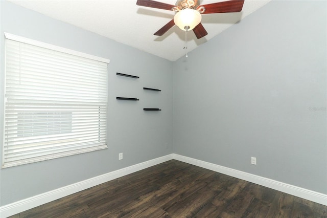 5165 Mystic Point Ct, Orlando, FL 32812 - empty room with baseboards, dark wood-type flooring, lofted ceiling, and a ceiling fan