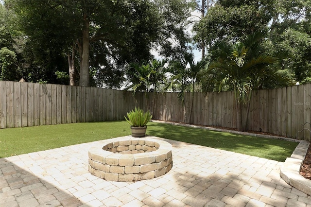 5165 Mystic Point Ct, Orlando, FL 32812 - view of patio / terrace featuring an outdoor fire pit