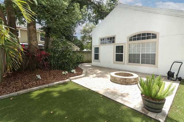 5165 Mystic Point Ct, Orlando, FL 32812 - view of patio featuring a fire pit