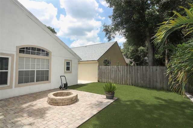 5165 Mystic Point Ct, Orlando, FL 32812 - view of yard featuring a patio and an outdoor fire pit