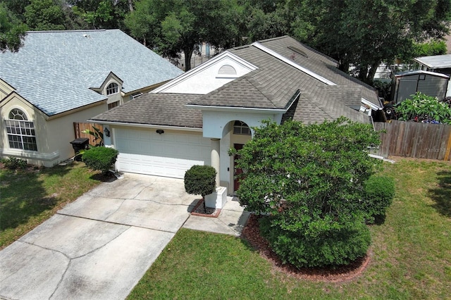 5165 Mystic Point Ct, Orlando, FL 32812 - single story home featuring stucco siding, a garage, a shingled roof, and driveway