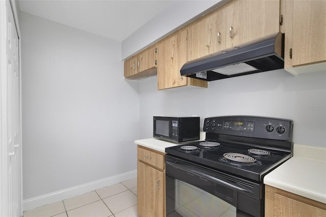 4870 S Semoran Blvd Unit 1905, Orlando, FL 32822 - kitchen with black appliances, under cabinet range hood, baseboards, light countertops, and light tile patterned floors