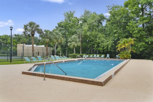 4870 S Semoran Blvd Unit 1905, Orlando, FL 32822 - community pool with view of scattered trees and a patio