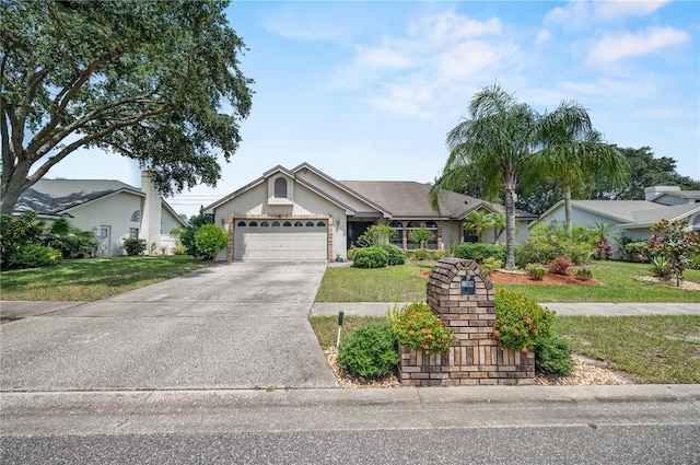 2209 Fairglenn Way, Winter Park, FL 32792 - ranch-style house with a front yard, concrete driveway, an attached garage, and stucco siding