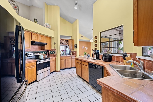 2209 Fairglenn Way, Winter Park, FL 32792 - kitchen featuring stainless steel range with electric stovetop, dishwasher, a sink, tile counters, and under cabinet range hood