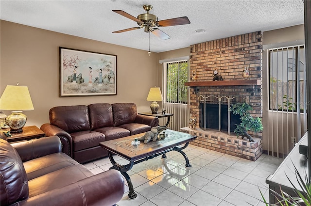 2209 Fairglenn Way, Winter Park, FL 32792 - living room with ceiling fan, tile patterned flooring, a textured ceiling, and a brick fireplace