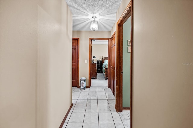 2209 Fairglenn Way, Winter Park, FL 32792 - hall with light tile patterned flooring, baseboards, and a textured ceiling