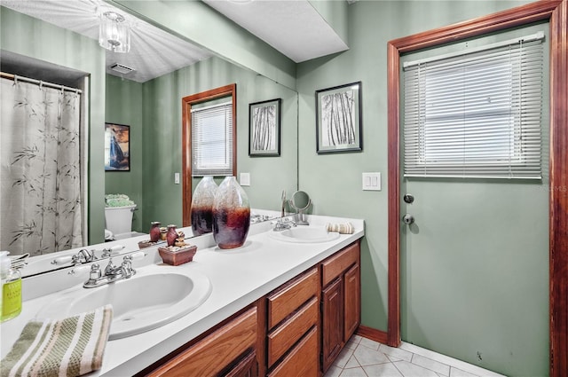 2209 Fairglenn Way, Winter Park, FL 32792 - full bath with double vanity, toilet, and tile patterned flooring