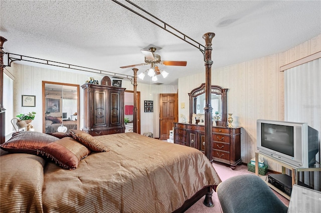 2209 Fairglenn Way, Winter Park, FL 32792 - bedroom with a textured ceiling, wallpapered walls, light carpet, and ceiling fan