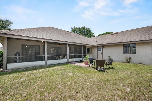2209 Fairglenn Way, Winter Park, FL 32792 - back of house featuring a sunroom, a lawn, stucco siding, and a shingled roof