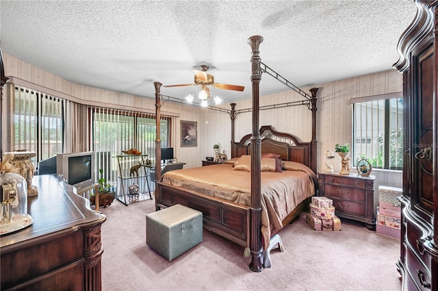2209 Fairglenn Way, Winter Park, FL 32792 - bedroom featuring carpet flooring, wood walls, and a textured ceiling