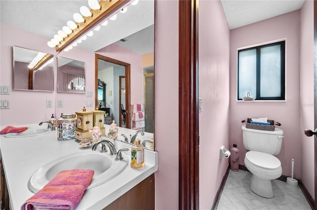 2209 Fairglenn Way, Winter Park, FL 32792 - bathroom featuring double vanity, toilet, a shower with shower door, and tile patterned flooring