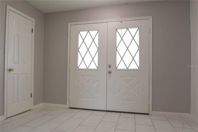1668 Fort Smith Blvd, Deltona, FL 32725 - entrance foyer featuring baseboards and light marble finish floors