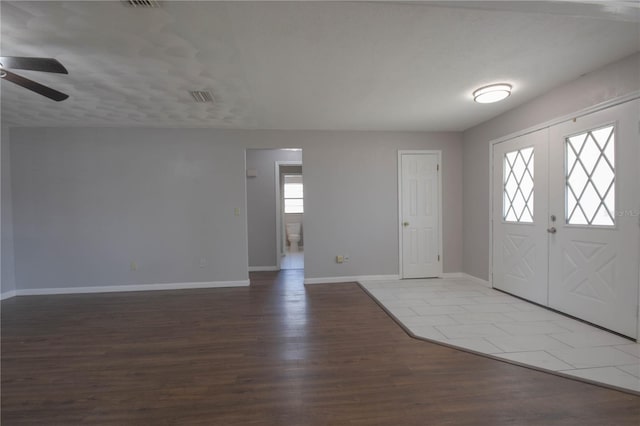 1668 Fort Smith Blvd, Deltona, FL 32725 - foyer with a ceiling fan, wood finished floors, and baseboards