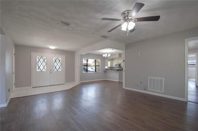 1668 Fort Smith Blvd, Deltona, FL 32725 - foyer with wood finished floors, ceiling fan, baseboards, and a chandelier