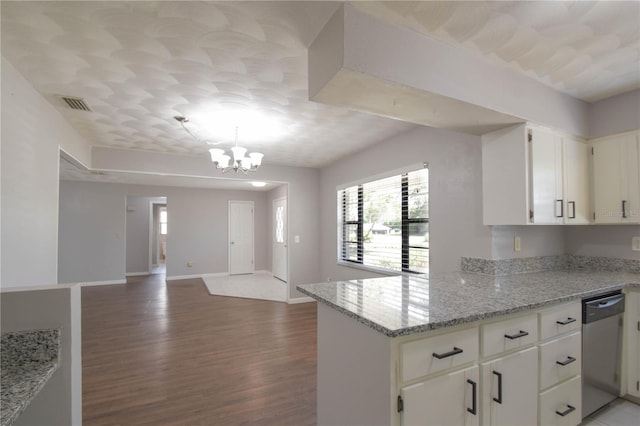 1668 Fort Smith Blvd, Deltona, FL 32725 - kitchen with stainless steel dishwasher, wood finished floors, open floor plan, a chandelier, and baseboards