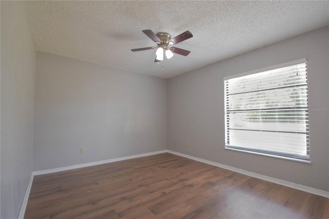 1668 Fort Smith Blvd, Deltona, FL 32725 - spare room featuring a textured ceiling, wood finished floors, a ceiling fan, and baseboards