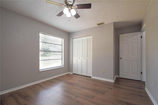 1668 Fort Smith Blvd, Deltona, FL 32725 - unfurnished bedroom with a textured ceiling, a closet, wood finished floors, baseboards, and a ceiling fan