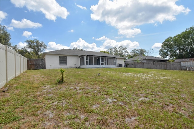 1668 Fort Smith Blvd, Deltona, FL 32725 - back of property featuring a sunroom and stucco siding