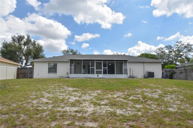 1668 Fort Smith Blvd, Deltona, FL 32725 - rear view of house featuring a sunroom and stucco siding