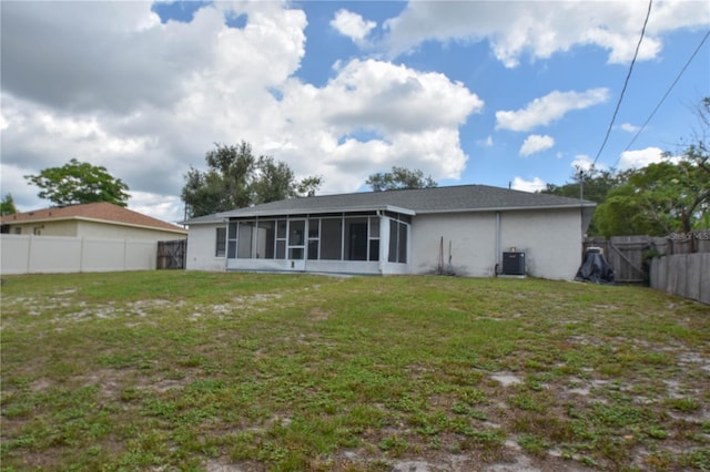 1668 Fort Smith Blvd, Deltona, FL 32725 - back of property featuring a sunroom, central AC, and stucco siding