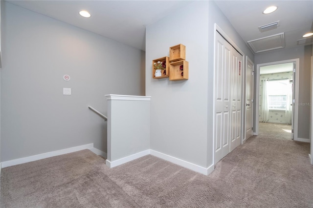 4414 Le Reve Ct, Kissimmee, FL 34746 - hall featuring an upstairs landing, carpet, baseboards, recessed lighting, and attic access