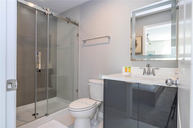 4414 Le Reve Ct, Kissimmee, FL 34746 - full bath featuring toilet, vanity, a stall shower, and tile patterned flooring
