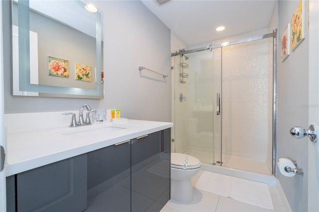 4414 Le Reve Ct, Kissimmee, FL 34746 - bathroom with vanity, toilet, a stall shower, tile patterned floors, and recessed lighting