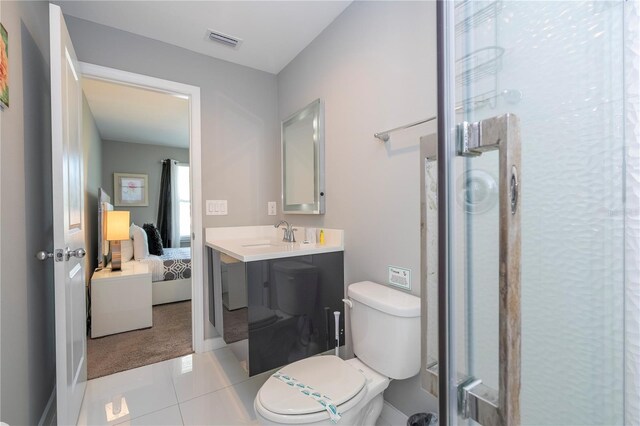 4414 Le Reve Ct, Kissimmee, FL 34746 - bathroom with a stall shower, toilet, vanity, ensuite bathroom, and tile patterned floors
