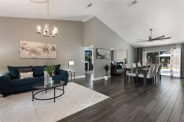2122 Palm Crest Dr, Apopka, FL 32712 - living room with wood finished floors, a chandelier, ceiling fan, baseboards, and high vaulted ceiling