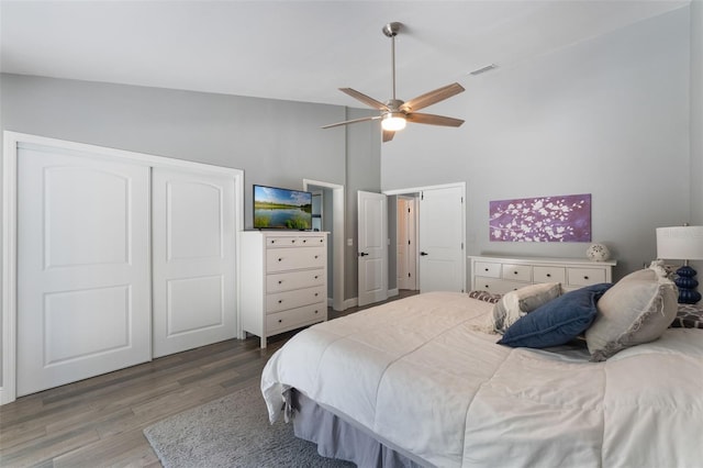 2122 Palm Crest Dr, Apopka, FL 32712 - bedroom featuring wood finished floors, high vaulted ceiling, and ceiling fan