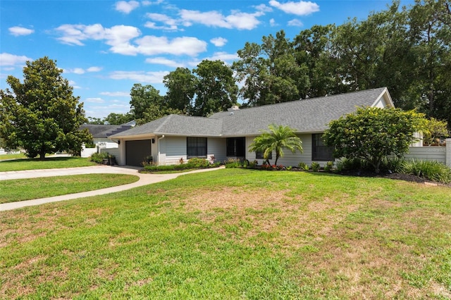 2122 Palm Crest Dr, Apopka, FL 32712 - ranch-style house featuring an attached garage, concrete driveway, and a front lawn
