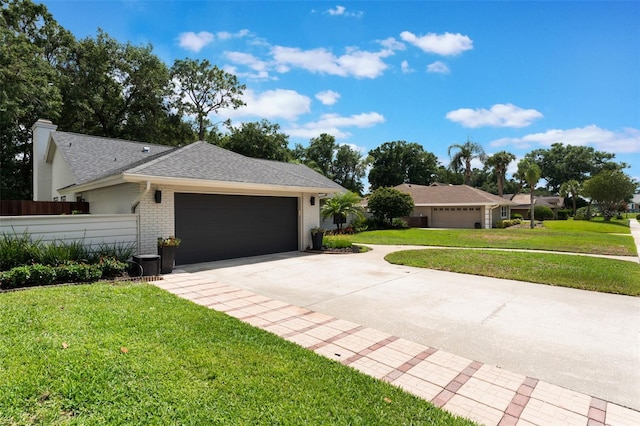 2122 Palm Crest Dr, Apopka, FL 32712 - view of front facade with a garage, driveway, a shingled roof, brick siding, and a chimney