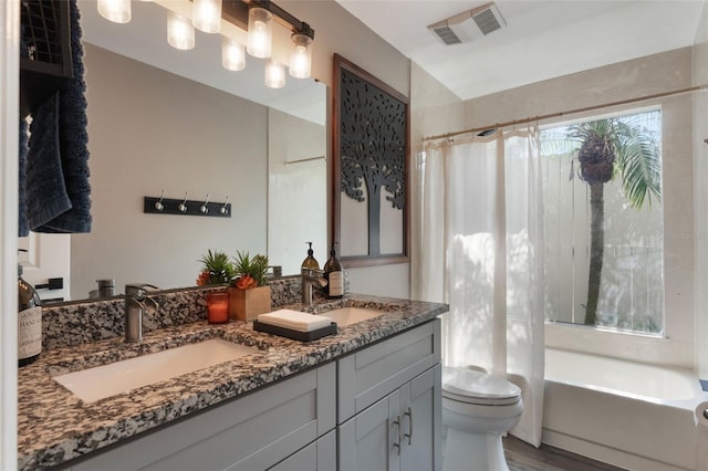 2122 Palm Crest Dr, Apopka, FL 32712 - bathroom with double vanity, toilet, and wood finished floors