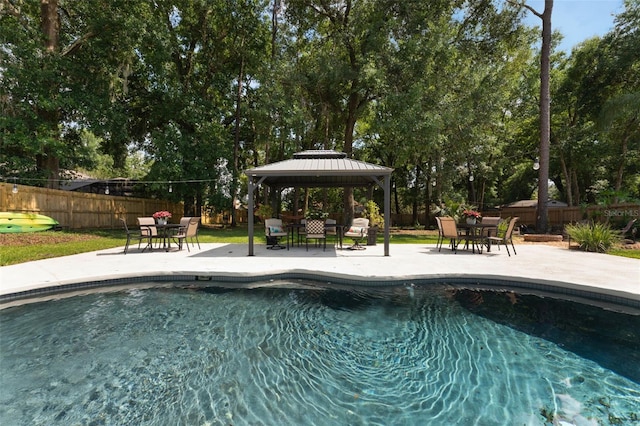 2122 Palm Crest Dr, Apopka, FL 32712 - view of pool with a gazebo, a patio, a fenced backyard, and outdoor dining area