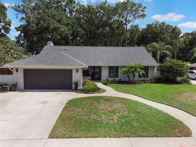 2122 Palm Crest Dr, Apopka, FL 32712 - single story home with an attached garage, driveway, a front lawn, a shingled roof, and a chimney