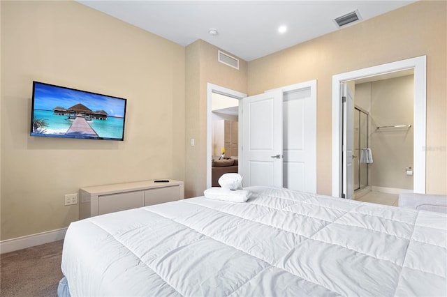 3149 Brasilia Ave, Kissimmee, FL 34747 - bedroom with light colored carpet and ensuite bathroom