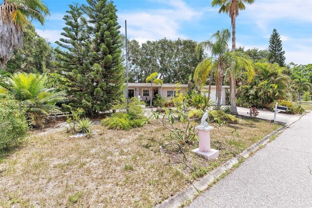 251 Tropic Blvd W, Largo, FL 33770 - view of front of property with an attached garage and concrete driveway