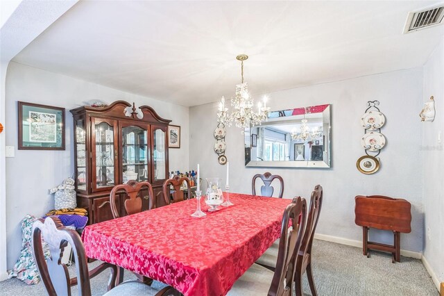 251 Tropic Blvd W, Largo, FL 33770 - dining area featuring a chandelier, carpet flooring, and baseboards
