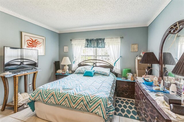 251 Tropic Blvd W, Largo, FL 33770 - tiled bedroom featuring a textured ceiling