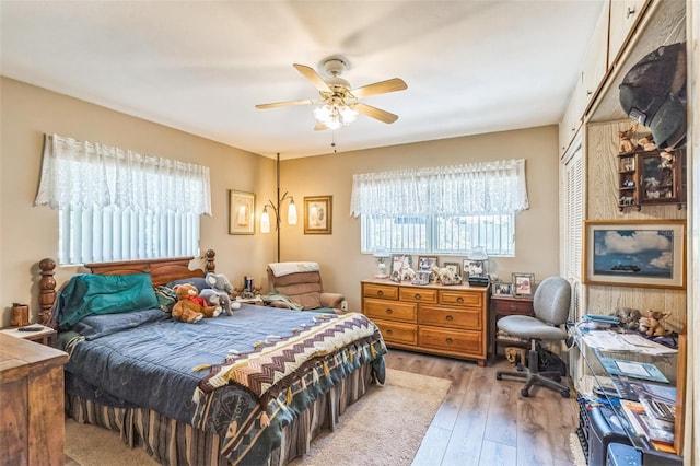 251 Tropic Blvd W, Largo, FL 33770 - bedroom featuring multiple windows, light wood-type flooring, a closet, and ceiling fan