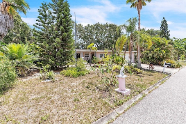 251 Tropic Blvd W, Largo, FL 33770 - view of front of property with an attached garage and concrete driveway