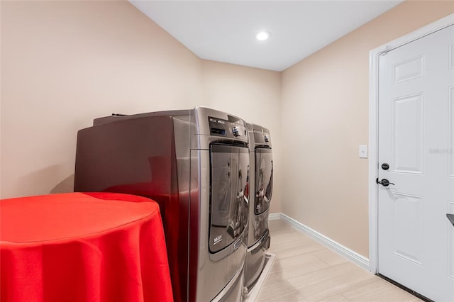 999 Trumbull St, Deltona, FL 32725 - laundry area with washer and clothes dryer, recessed lighting, and baseboards