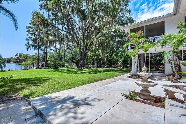 18620 Wayne Rd, Odessa, FL 33556 - view of green lawn with a patio area and a water view