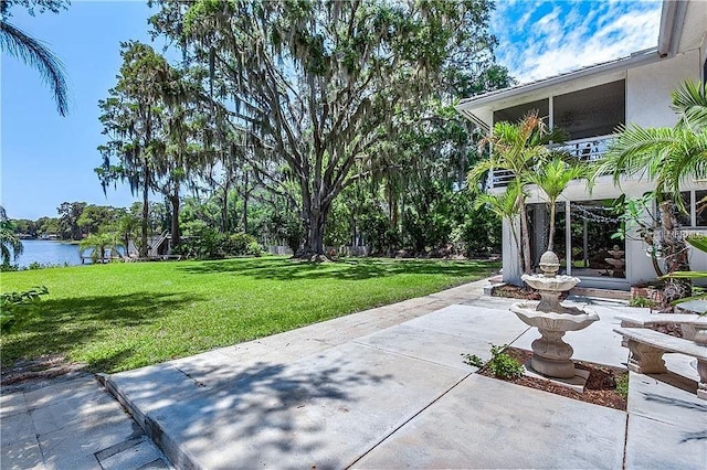 18620 Wayne Rd, Odessa, FL 33556 - view of green lawn with a patio area and a water view