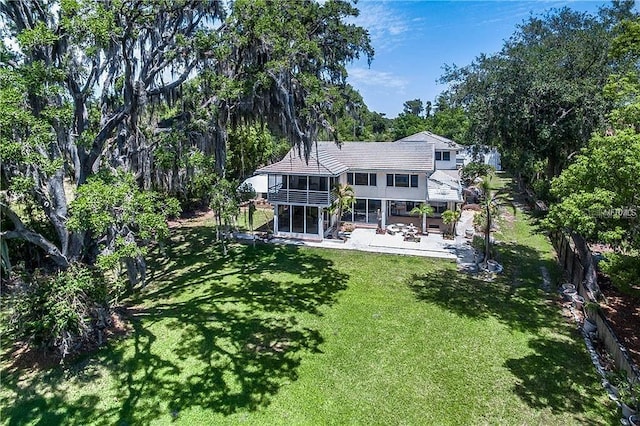 18620 Wayne Rd, Odessa, FL 33556 - rear view of house with a patio area, a lawn, and a deck