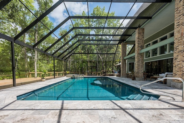 20 Twelve Oaks Trl, Ormond Beach, FL 32174 - view of swimming pool with a pool with connected hot tub, a patio, and glass enclosure
