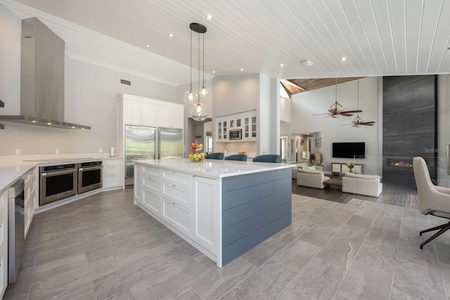 20 Twelve Oaks Trl, Ormond Beach, FL 32174 - kitchen featuring stainless steel appliances, wall chimney exhaust hood, wood ceiling, a ceiling fan, and open floor plan