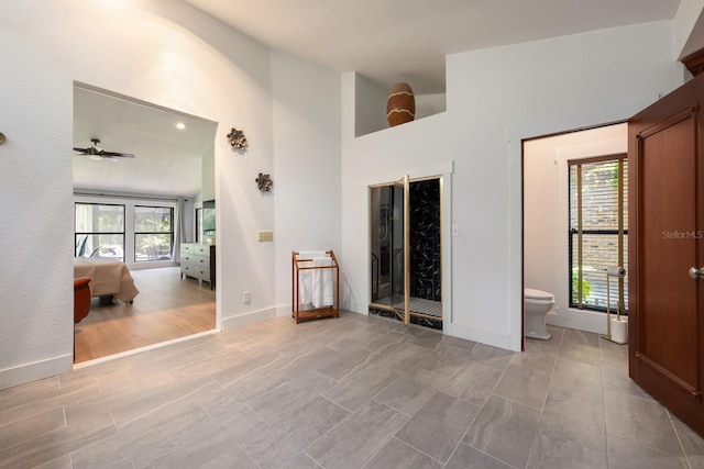20 Twelve Oaks Trl, Ormond Beach, FL 32174 - unfurnished room featuring healthy amount of natural light, ceiling fan, baseboards, and high vaulted ceiling