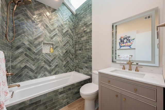 20 Twelve Oaks Trl, Ormond Beach, FL 32174 - full bathroom with toilet, vanity, tiled shower / bath combo, and wood finished floors